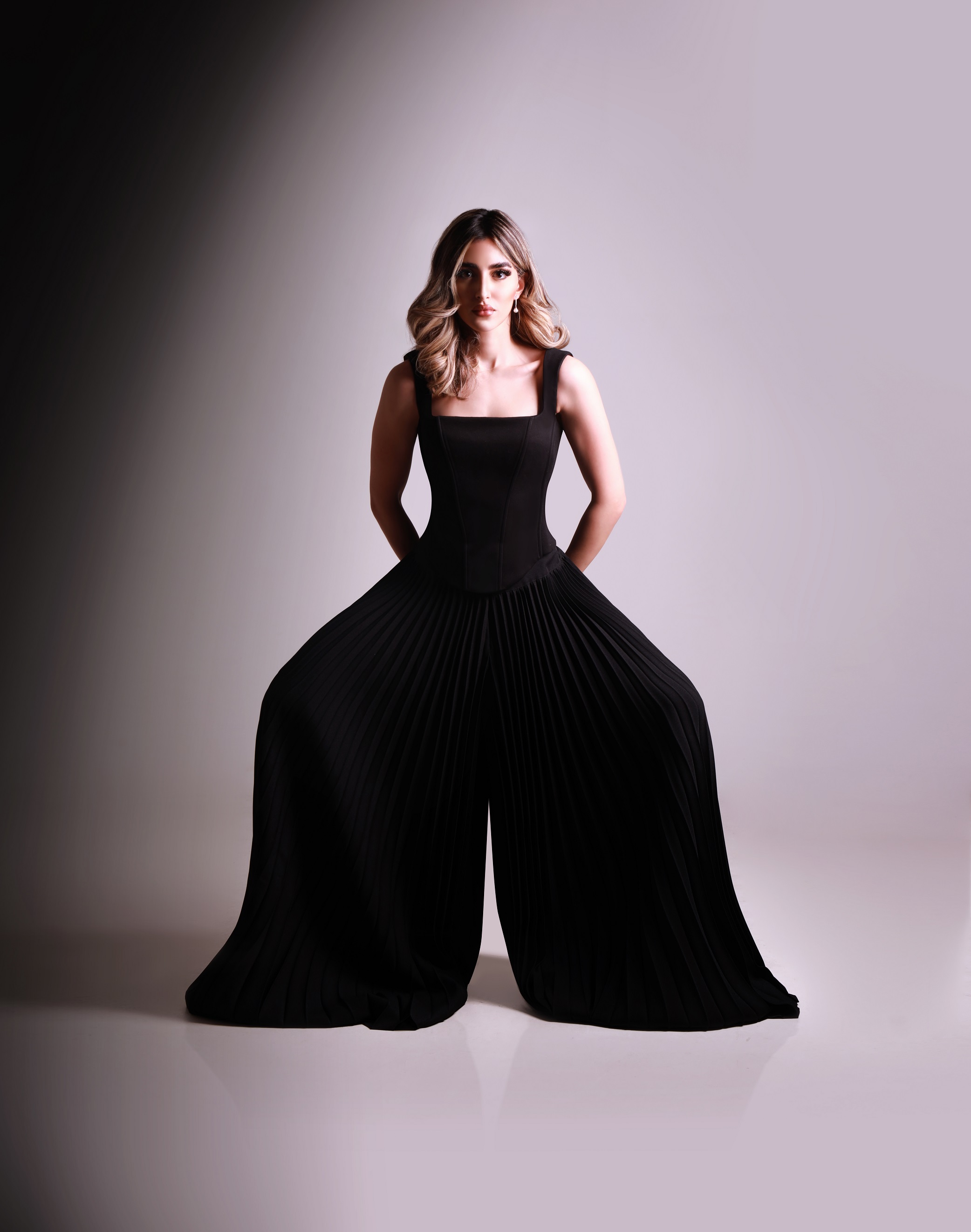 Aya Abaakil in a sculptural black gown